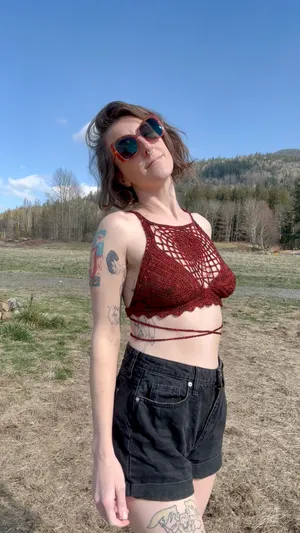 Crocheted halter top with lace over the chest and crossed ties