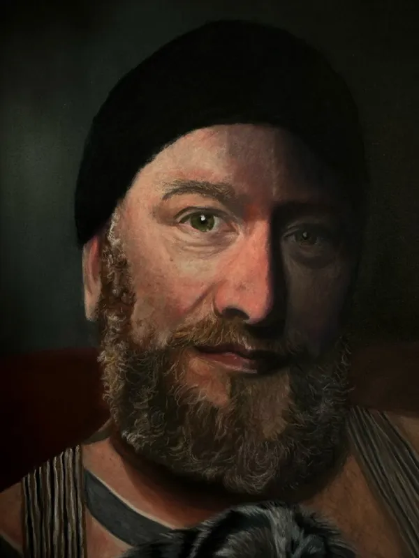 detail of man's face, wearing a beanie