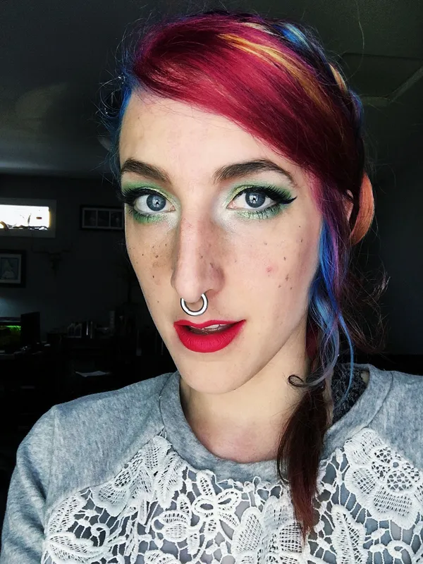 Vibrant green gradient eyes with rainbow hair