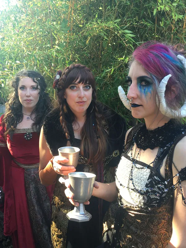 flame-like blue eye makeup dripping down cheeks, paired with sorceress costume