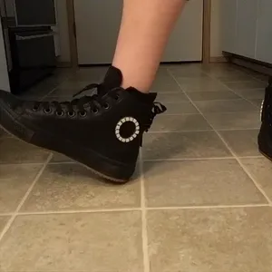 Black converse high top boots with a circle of LEDs that light up with each step