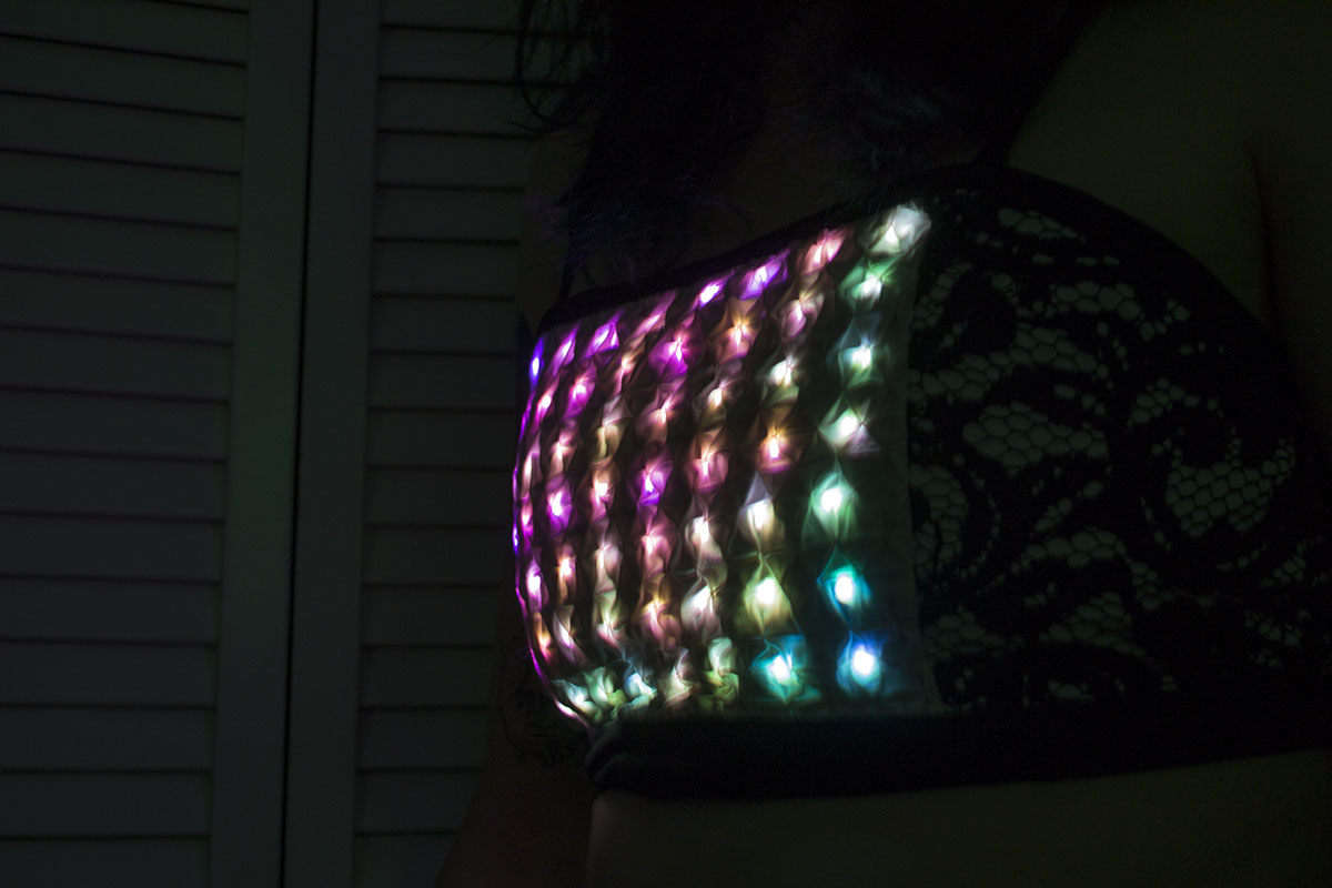 a matrix of rainbow leds under textured fabric